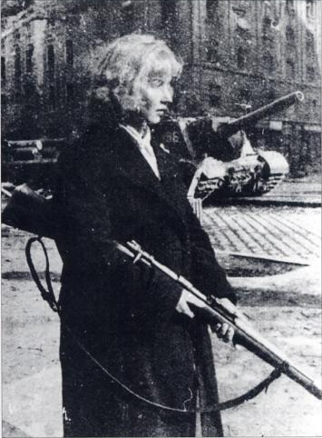 A female revolutionary solider holding a rifle.