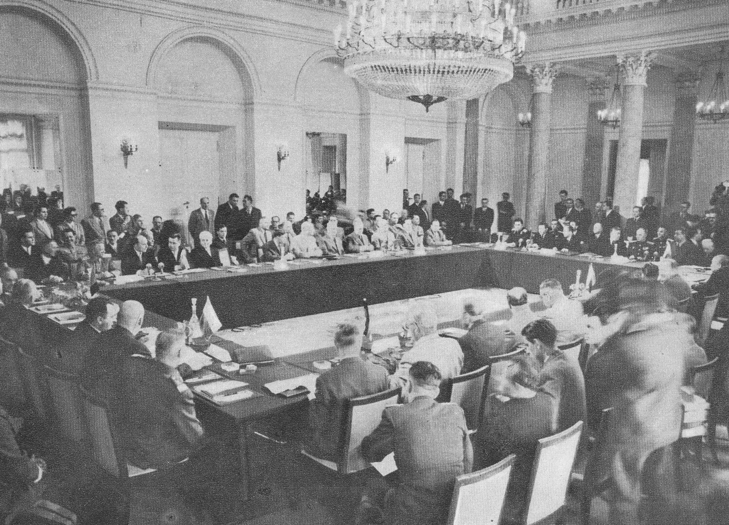 Politicians sat around a large table at the signing of the Warsaw Pact.